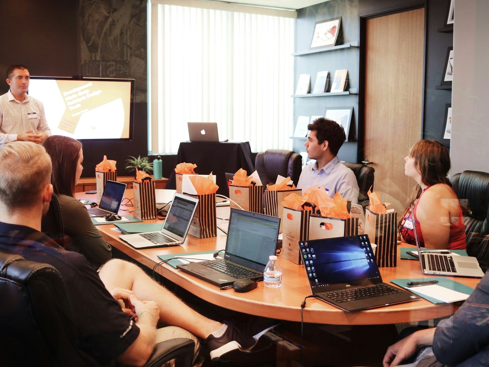Finance and HR teams reviewing compliance reports