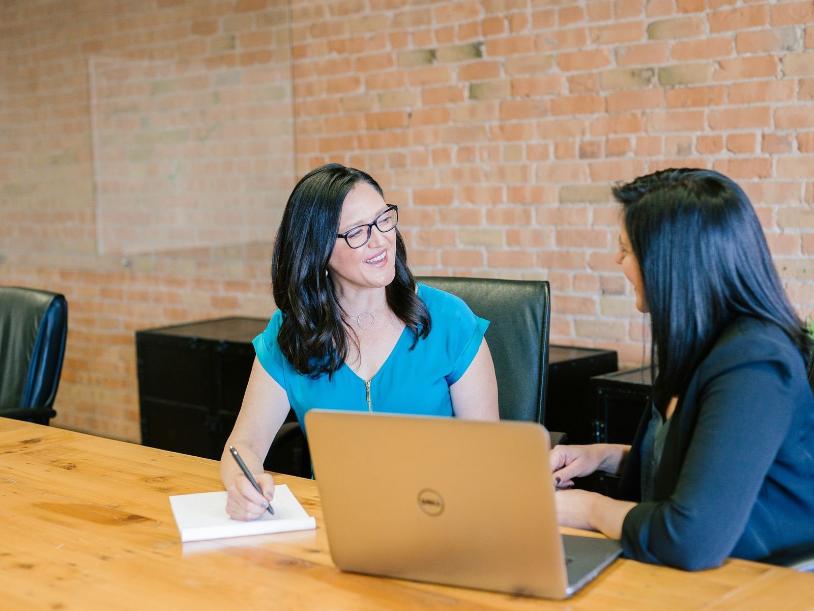 CFO and finance manager discussing a dashboard